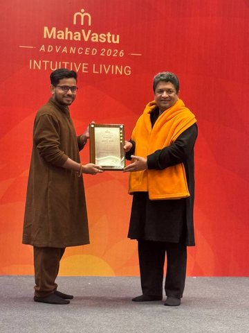 Acharya Pushpak V Kumbhare receiving his MahaVastu Acharya award at MahaVastu Advanced 2026, Intuitive Living.